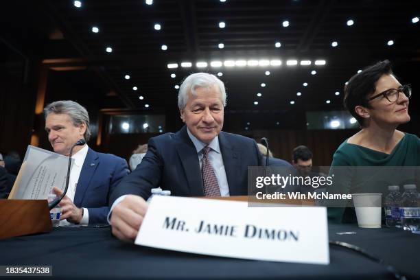 Jamie Dimon, Chairman and CEO of JPMorgan Chase, arrives to testify at a Senate Banking Committee hearing at the Hart Senate Office Building on...