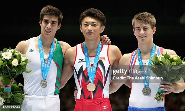 Daniel Corral Barron of Mexico, Kohei Kameyama of Japan and Max Whitlock of Great Britain pose after the Pommel Horse Final on Day Six of the...