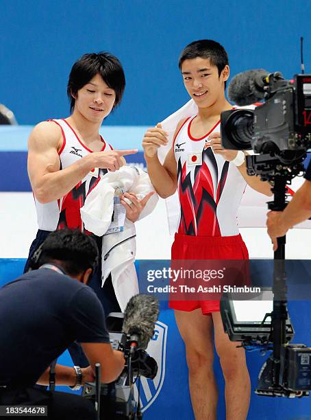 Kohei Uchimura of Japan and Kenzo Shirai of Japan celebrate pose after competing in Floor Exercise Final on Day Six of the Artistic Gymnastics World...