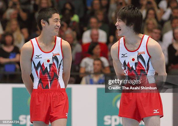 Kenzo Shirai of Japan and Kohei Uchimura of Japan smile after the Floor Exercise Final on Day Six of the Artistic Gymnastics World Championships...