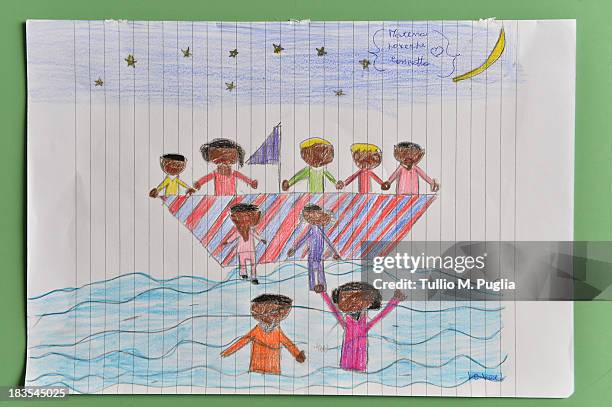 Drawing created by a student relating to the recent shipwreck off the Italian coast are displayed in the Elementary School of Lampedusa on October 7,...