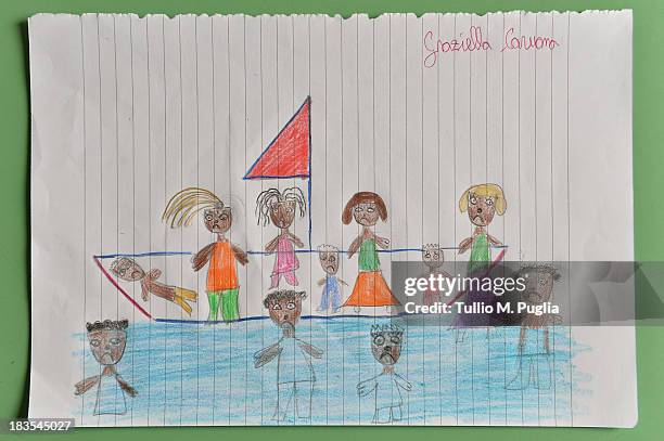 Drawing created by a student relating to the recent shipwreck off the Italian coast are displayed in the Elementary School of Lampedusa on October 7,...