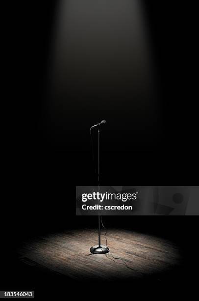 stage microphone - in the spotlight stockfoto's en -beelden