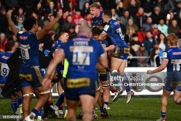 Exeter Chiefs' English hooker Max Norey leads Exeter's players celebration after their victory in their European Champions Cup rugby union match...
