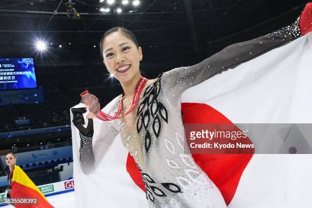 Japan's Hana Yoshida smiles after winning bronze at the Grand Prix Final figure skating competition in Beijing on Dec. 9, 2023.