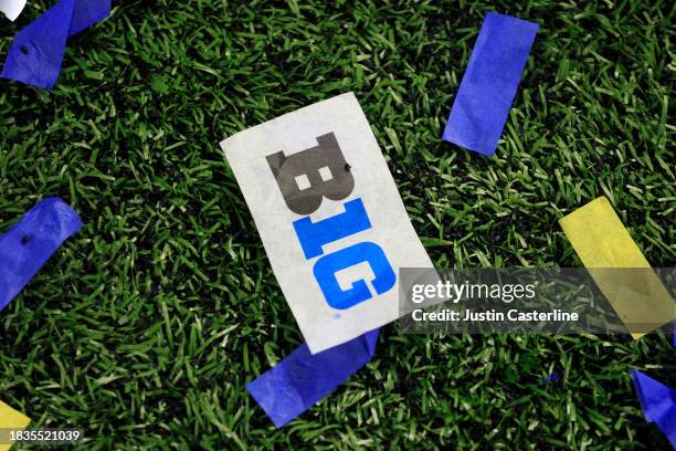 Confetti with the Big Ten Logo is seen on the field after the Michigan Wolverines beat the Iowa Hawkeyes during the Big Ten Championship at Lucas Oil...