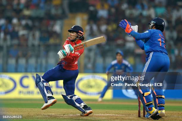 Sophia Dunkley of England plays a shot during the 2nd T20 International match between India Women and England Women at Wankhede Stadium on December...