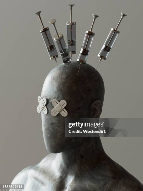 face of mannequin with band aid eyes and syringes in head against gray background - needle injury stock pictures, royalty-free photos & images