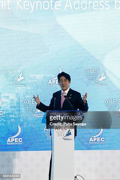 Japanese Prime Minister Shinzo Abe delivers his keynote address during the APEC CEO Summit on October 7, 2013 in Nusa Dua, Indonesia. US President...