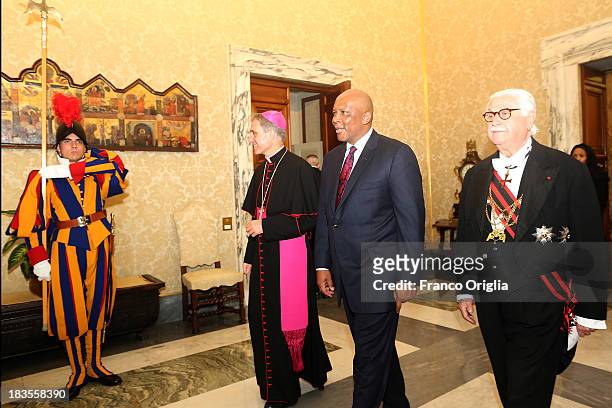 King of Lesotho Letsie III , flanked by Prefect of the Pontifical House and former personal secretary of Pope Benedict XVI Georg Ganswein arrives at...