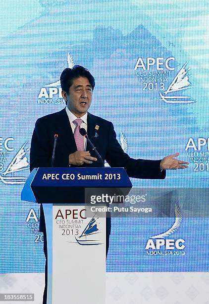 Japanese Prime Minister Shinzo Abe delivers his keynote address during the APEC CEO Summit on October 7, 2013 in Nusa Dua, Indonesia. US President...