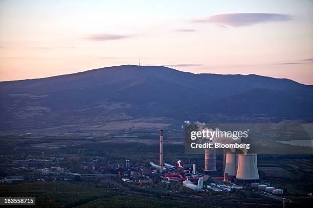 Vapour rises from the cooling towers of the coal fired power plant, operated by RWE AG, near Gyongyos, Hungary, on Thursday, Oct. 3, 2013. Hungarian...