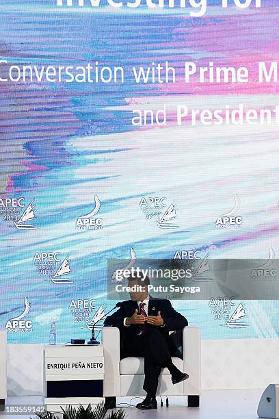 Mexico President Enrique Pena Nieto talks at a panel discussion during APEC CEO Summit on October 7, 2013 in Nusa Dua, Indonesia. US President Barack...