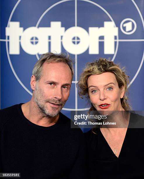 Actor Wolfram Koch and actress Margarita Broich react during a press conference on October 7, 2013 in Frankfurt am Main, Germany. The television...