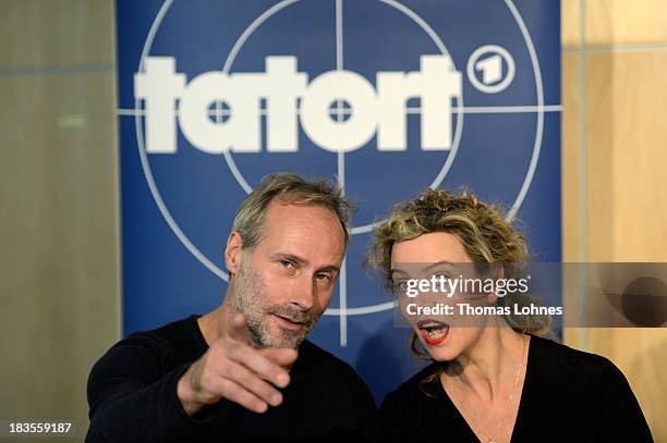 Actor Wolfram Koch and actress Margarita Broich react during a press conference on October 7, 2013 in Frankfurt am Main, Germany. The television...