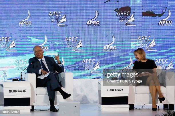 Malaysian Prime Minister Najib Razak and Senior Editor of Bloomberg Businessweek Diane Brady laugh during a panel discussion during the APEC CEO...