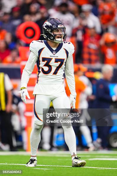 Jud Riley Denver Riley Moss of the Denver Broncos makes a call during an NFL football ...