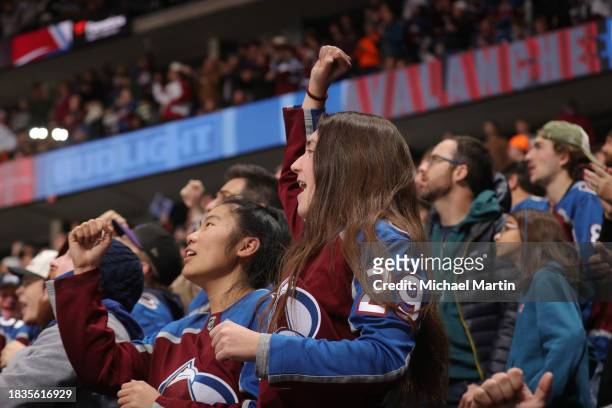 Fans of the Colorado Avalanche cheer against the Anaheim Ducks at Ball Arena on December 5, 2023 in Denver, Colorado.