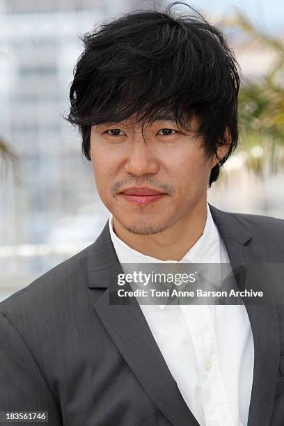 Joonsang Yu attends the 'Ha Ha Ha' Photocall held at the Palais des Festivals during the 63rd Annual International Cannes Film Festival on May 21,...