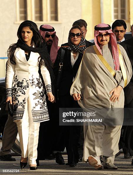 Saudi Prince AlWalid bin Talal bin Abdul Aziz Al Saud walks with his