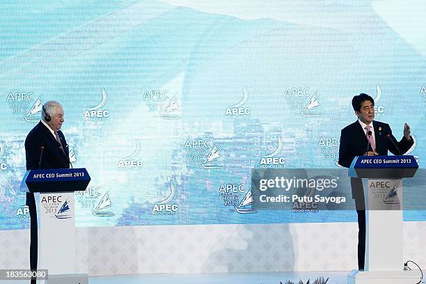 President and CEO Freeport-McMoran Copper & Gold Inc Richard Adkerson looks on as Japanese Prime Minister Shinzo Abe delivers a keynote address on...