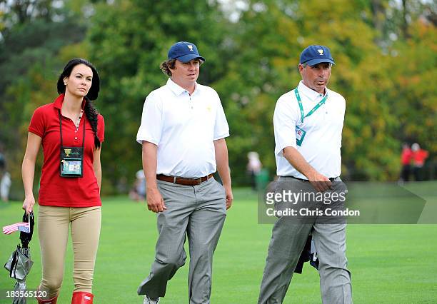 Amanda Dufner, Jason Dufner and U.S. Team captain Fred Couples is seen during the Final Round Singles Matches of The Presidents Cup at the Muirfield...