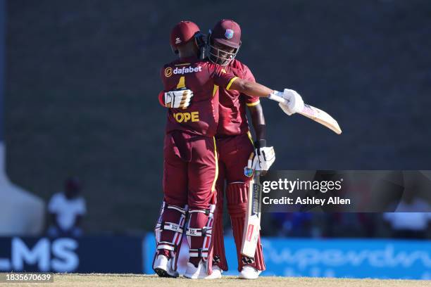 Sherfane Rutherford of West Indies brings up his maiden ODI 50 runs as teammate Shai Hope congratulates him during the 2nd CG United One Day...