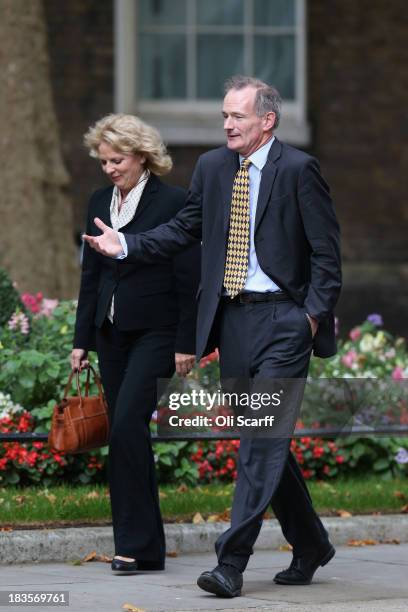 Anna Soubry MP and John Penrose MP arrive at Number 10 Downing Street on October 7, 2013 in London, England. British Prime Minister David Cameron...