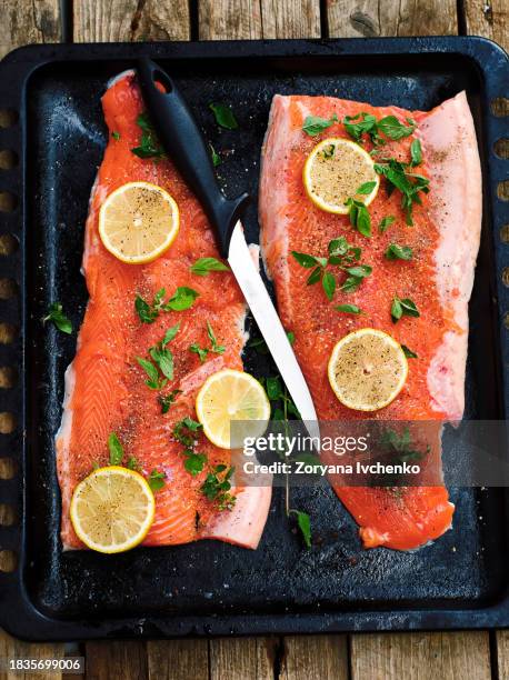 fresh trout on a wooden board - rainbow trout fish stock pictures, royalty-free photos & images