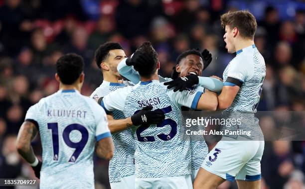 Marcos Senesi of AFC Bournemouth celebrates with teammates after scoring his team's first goal during the Premier League match between Crystal Palace...