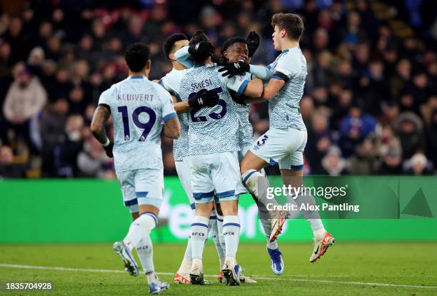 Marcos Senesi of AFC Bournemouth celebrates with teammates after scoring his team's first goal during the Premier League match between Crystal Palace...