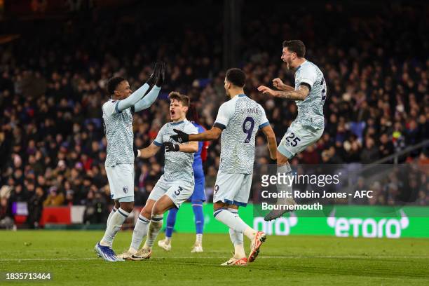 Marcos Senesi of Bournemouth turns to celebrate with team-mates Luis Sinisterra, Milos Kerkez and Dominic Solanke after he heads in and scores a goal...