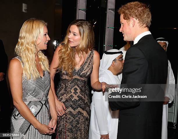 Prince Harry meets singer Joss Stone and presenter Denise Van Outen as he attends a reception ahead of the Sentable 'Forget Me Not' dinner on October...