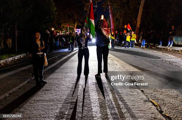 Members of the Palestinian Youth Movement calling for a ceasefire in Gaza rally Friday in the streets nearby after attending a rally at Holmby Park...