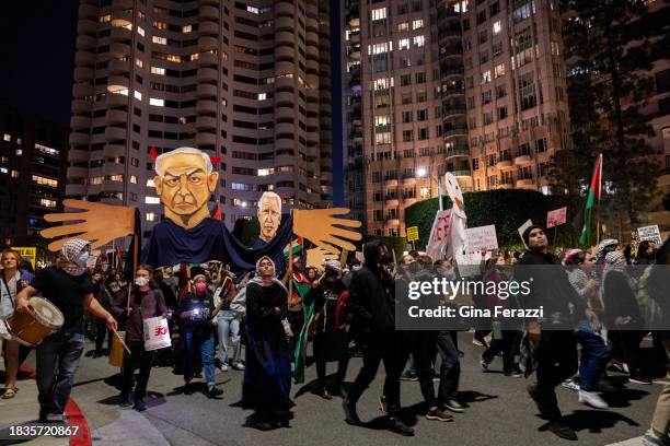 Members of the Palestinian Youth Movement calling for a ceasefire in Gaza march on Wilshire Boulevard Friday after attending a rally at Holmby Park...