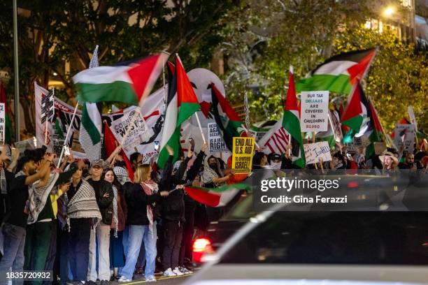 Members of the Palestinian Youth Movement calling for a ceasefire in Gaza march on Wilshire Boulevard Friday after attending a rally at Holmby Park...