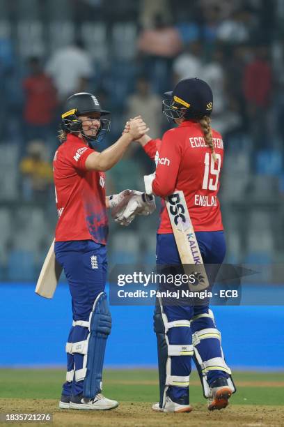 Heather Knight captain of England and Sophie Ecclestone of England celebrate their team's win over India during the 2nd T20 International match...