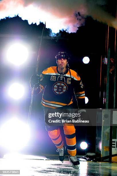 Zdeno Chara of the Boston Bruins waves to the crowd before the game against the Tampa Bay Lightning at the TD Garden on October 3, 2013 in Boston,...