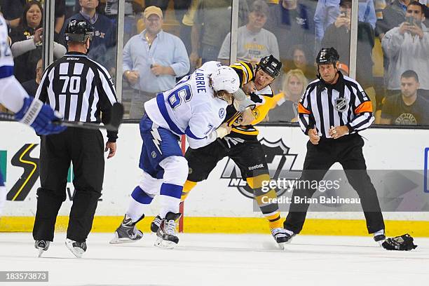 Shawn Thornton of the Boston Bruins squares up to fight against Pierre-Cedric Labrie of the Tampa Bay Lightning at the TD Garden on October 3, 2013...