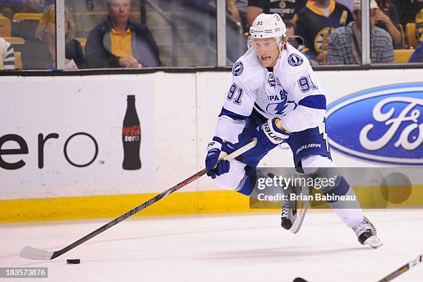 Steven Stamkos of the Tampa Bay Lightning skates with the puck against the Boston Bruins at the TD Garden on October 3, 2013 in Boston, Massachusetts.