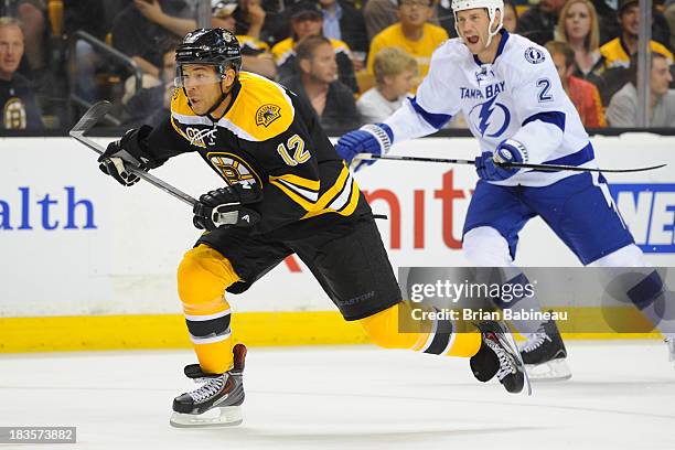 Jarome Iginla of the Boston Bruins skates hard down the ice against the Tampa Bay Lightning at the TD Garden on October 3, 2013 in Boston,...