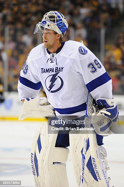 Anders Lindback of the Tampa Bay Lightning skates back to his net during a time out against the Boston Bruins at the TD Garden on October 3, 2013 in...