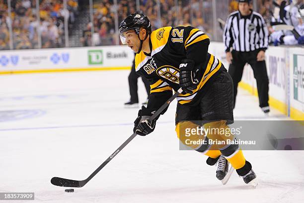 Jarome Iginla of the Boston Bruins skates with the puck against the Tampa Bay Lightning at the TD Garden on October 3, 2013 in Boston, Massachusetts.
