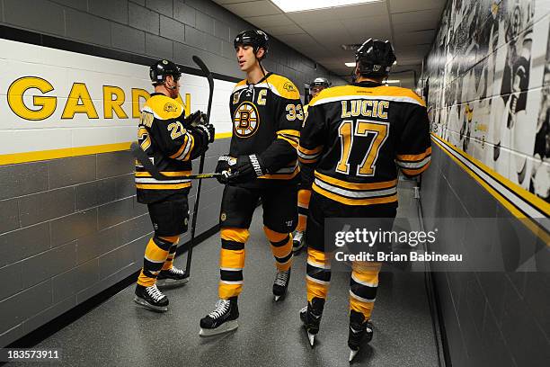 Zdeno Chara of the Boston Bruins with his teammates in the hallway before warm ups prior to the game against the Tampa Bay Lightning at the TD Garden...