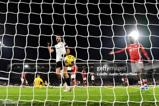 Raul Jimenez of Fulham celebrates scoring his team's second goal during the Premier League match between Fulham FC and Nottingham Forest at Craven...