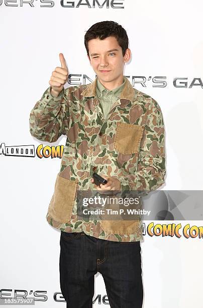 Asa Butterfield attends a photocall to promote "Ender's Game" at Odeon Leicester Square on October 7, 2013 in London, England.