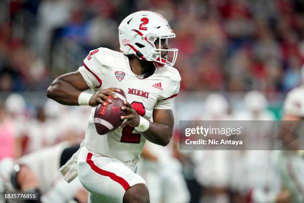 Aveon Smith of the Miami Redhawks looks to pass the ball against the Toledo Rockets during the MAC Championship at Ford Field on December 02, 2023 in...