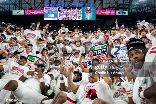 The Miami Redhawks celebrate winning the MAC Championship against the Toledo Rockets at Ford Field on December 02, 2023 in Detroit, Michigan.