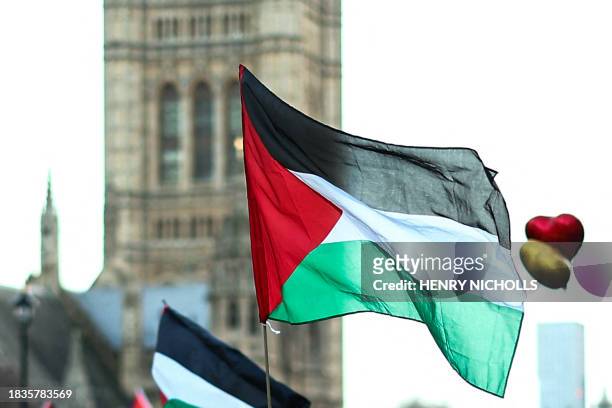 Palestinian flag is pictured during a National March for Palestine in central London on December 9 calling for full ceasefire in the war in Gaza....