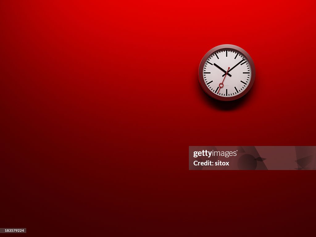 Clock on red wall